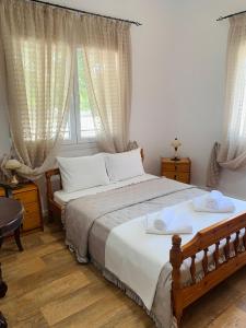 Postel nebo postele na pokoji v ubytování Villa Thea