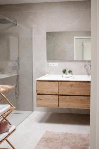 a bathroom with a sink and a shower at Brand New Apartment Sint-niklaas in Sint-Niklaas