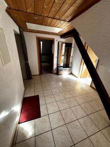 an empty room with a ceiling and a tile floor at Fewo in Zell-Merl in Zell an der Mosel