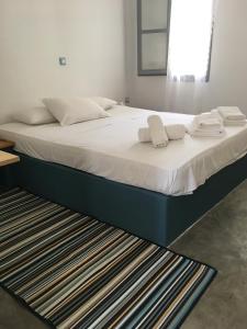Cama ou camas em um quarto em Cristi Rooms