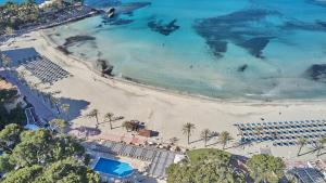 an aerial view of a beach with a resort at Secrets Mallorca Villamil Resort & Spa - Adults Only (+18) in Paguera