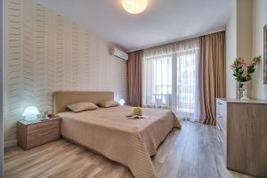 Giường trong phòng chung tại Dreams in La Mer +81 ảnh