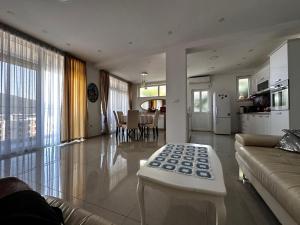 a living room with a couch and a table at Modern and cosy flat in Kotor Bay in Herceg-Novi +7 photos