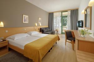 Postel nebo postele na pokoji v ubytování Hotel Aurora Plava Laguna
