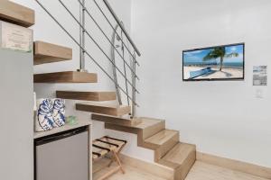 TV a/nebo společenská místnost v ubytování Iguana Surf Camp