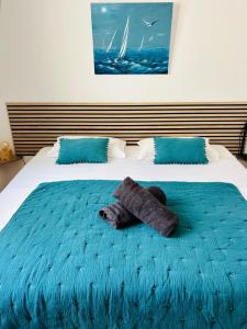 a bed with a teddy bear laying on it at Eden B7 Appartement in Saint-Tropez +22 photos