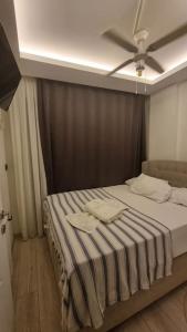 Postel nebo postele na pokoji v ubytování Villa Oyster Park Isıtmalı Yıldız Efektli Çocuk Havuzlu Villa