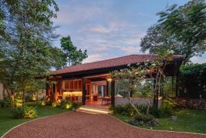 a house with a pathway leading to the front yard at The Garden Pavilion in Colombo
