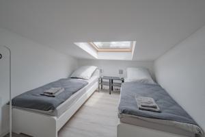 Ένα ή περισσότερα κρεβάτια σε δωμάτιο στο WORK&SLEEP Moderne Apartments in Villingen Schwenningen - Einzelbetten, TV, Bettwäsche & Handtücher, WLAN