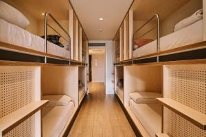 a room filled with lots of bunk beds at TOC Hostel Barcelona in Barcelona
