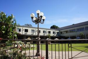 Um jardim em Samuara Hotel Caxias do Sul