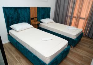 Voodi või voodid majutusasutuse Apollonia Hotel toas