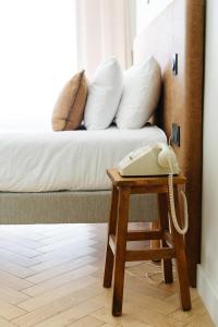 Hôtel Le Mouton Bleu客房内的一张或多张床位