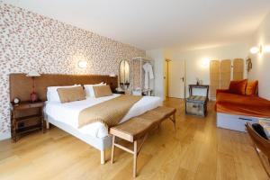 Hôtel Le Mouton Bleu客房内的一张或多张床位