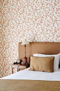 Hôtel Le Mouton Bleu客房内的一张或多张床位