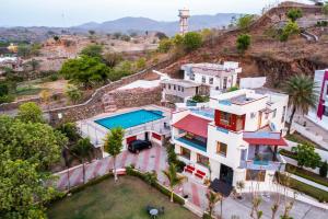 an aerial view of a house with a lighthouse at Meera Valley Resort By Nexottel in Udaipur