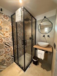 a bathroom with a shower and a sink at Borgo Sant Angelo in Conversano +42 photos