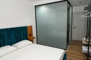 Voodi või voodid majutusasutuse Apollonia Hotel toas