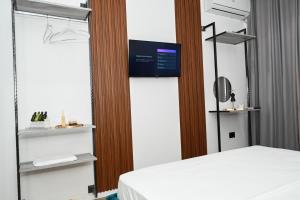 Voodi või voodid majutusasutuse Apollonia Hotel toas