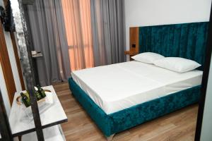Voodi või voodid majutusasutuse Apollonia Hotel toas