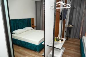 Voodi või voodid majutusasutuse Apollonia Hotel toas