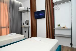 Voodi või voodid majutusasutuse Apollonia Hotel toas