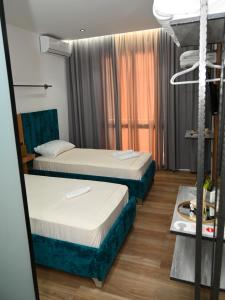 Voodi või voodid majutusasutuse Apollonia Hotel toas