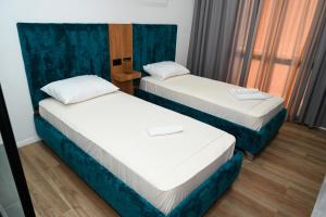 Voodi või voodid majutusasutuse Apollonia Hotel toas