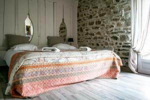Postel nebo postele na pokoji v ubytování Gîte Les Dalias