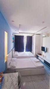 Postel nebo postele na pokoji v ubytování HOTEL & APARTMENT VY VAN