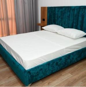 Voodi või voodid majutusasutuse Apollonia Hotel toas
