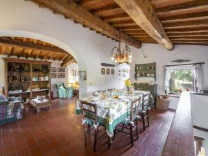 a large dining room with a table and chairs at Holiday Home Il Lamone by Interhome in Ambra