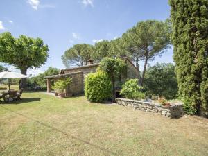 an external view of a stone house with a garden at Holiday Home Il Lamone by Interhome in Ambra