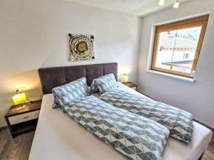 Łóżko lub łóżka w pokoju w obiekcie Holiday Home Heidi by Interhome