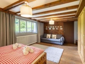 Postel nebo postele na pokoji v ubytování Chalet Chalet am Schärm by Interhome