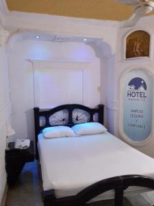 Postel nebo postele na pokoji v ubytování hotel avenida53