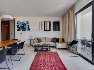 a living room with a couch and a table at Villa Inizio by Interhome in Brodarica
