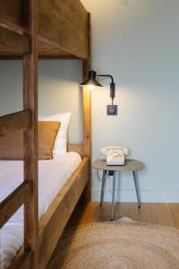 Hôtel Le Mouton Bleu客房内的一张或多张床位