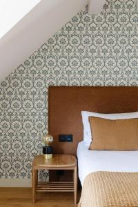Hôtel Le Mouton Bleu客房内的一张或多张床位