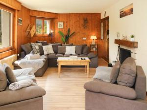 a living room with couches and a table at Apartment Résidence 25 by Interhome in Champex