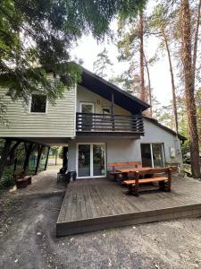 a house with a wooden deck in front of it at Lawenda in Turawa +11 photos