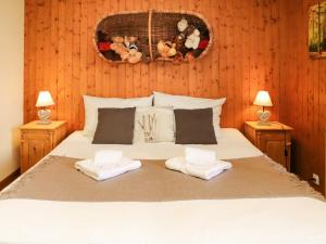 a bedroom with a bed with teddy bears on the wall at Apartment Résidence 25 by Interhome in Champex