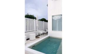 a swimming pool on the balcony of a house at ZenBreak The Nest 3bd in Saint James