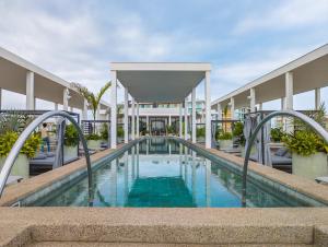 a swimming pool in the middle of a building at Hotel Mio Riviera Nayarit - Adults Only in Nuevo Vallarta