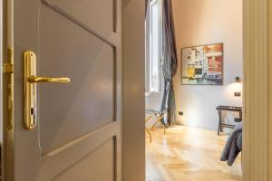 a door leading to a room with a table at Casa Galatea in Canton de Fiori in Bologna