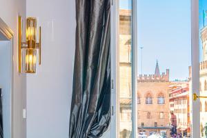 a window with a view of a building at Casa Galatea in Canton de Fiori in Bologna