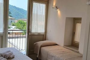 Postel nebo postele na pokoji v ubytování CalYpso 1 - Franciacorta Love