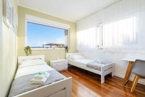 Posteľ alebo postele v izbe v ubytovaní Villa Karmen