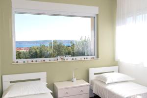 Posteľ alebo postele v izbe v ubytovaní Villa Karmen