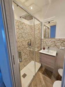 a bathroom with a shower and a sink at Casa al mare Angela in Ventimiglia
